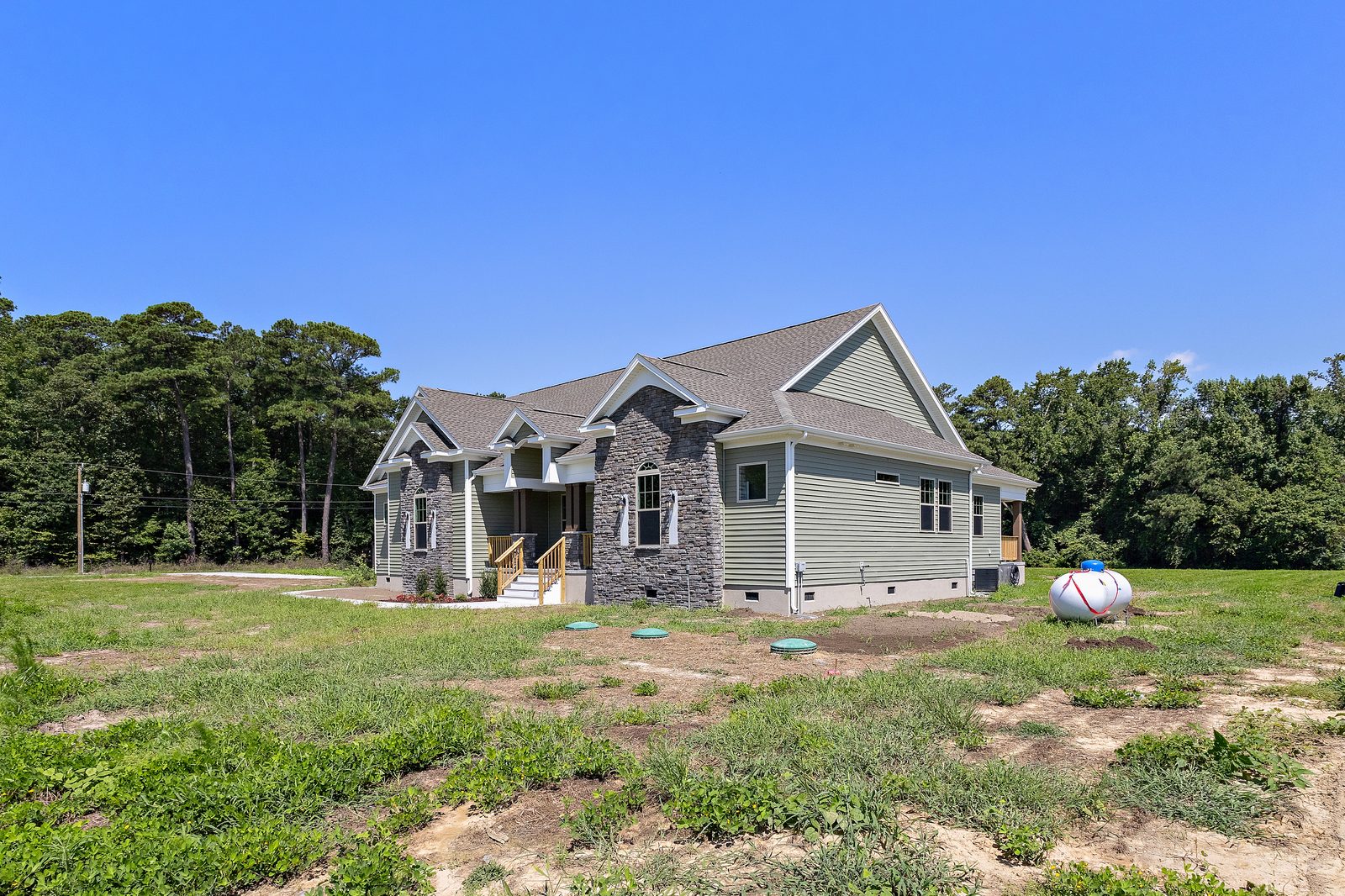 One-story Ava model home on a wooded lot
